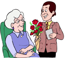 moederdag, man geeft rode rozen aan zijn moeder